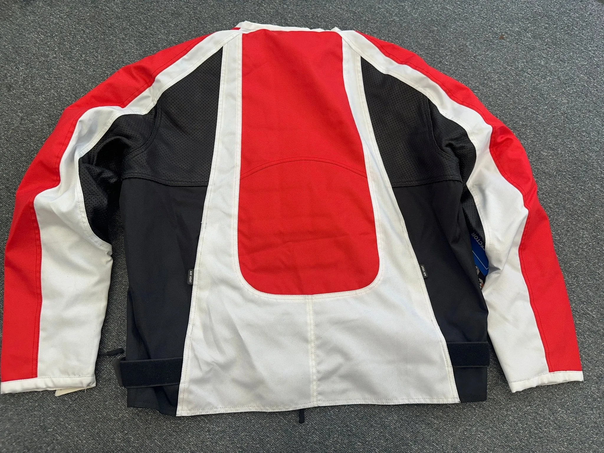 Collarless Black Red and White Textile and Black Porforated Leather Jacket Size XL