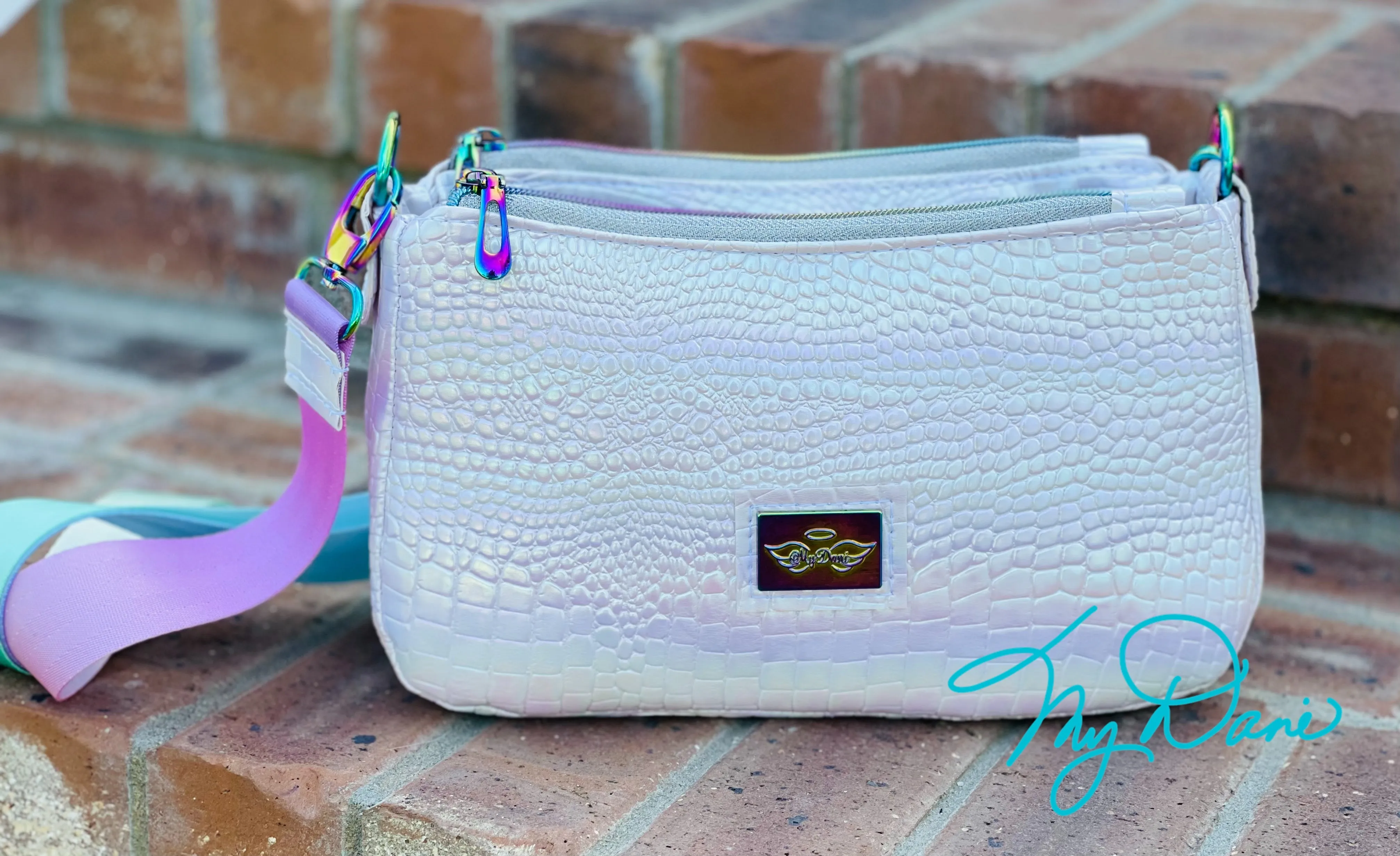 The Aries Crossbody Handbag in Iridescent White.