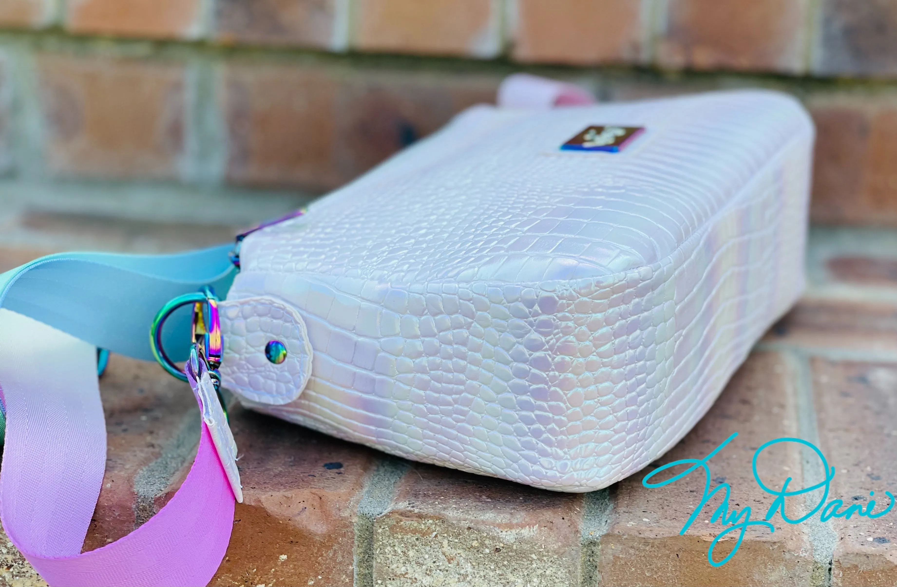 The Aries Crossbody Handbag in Iridescent White.