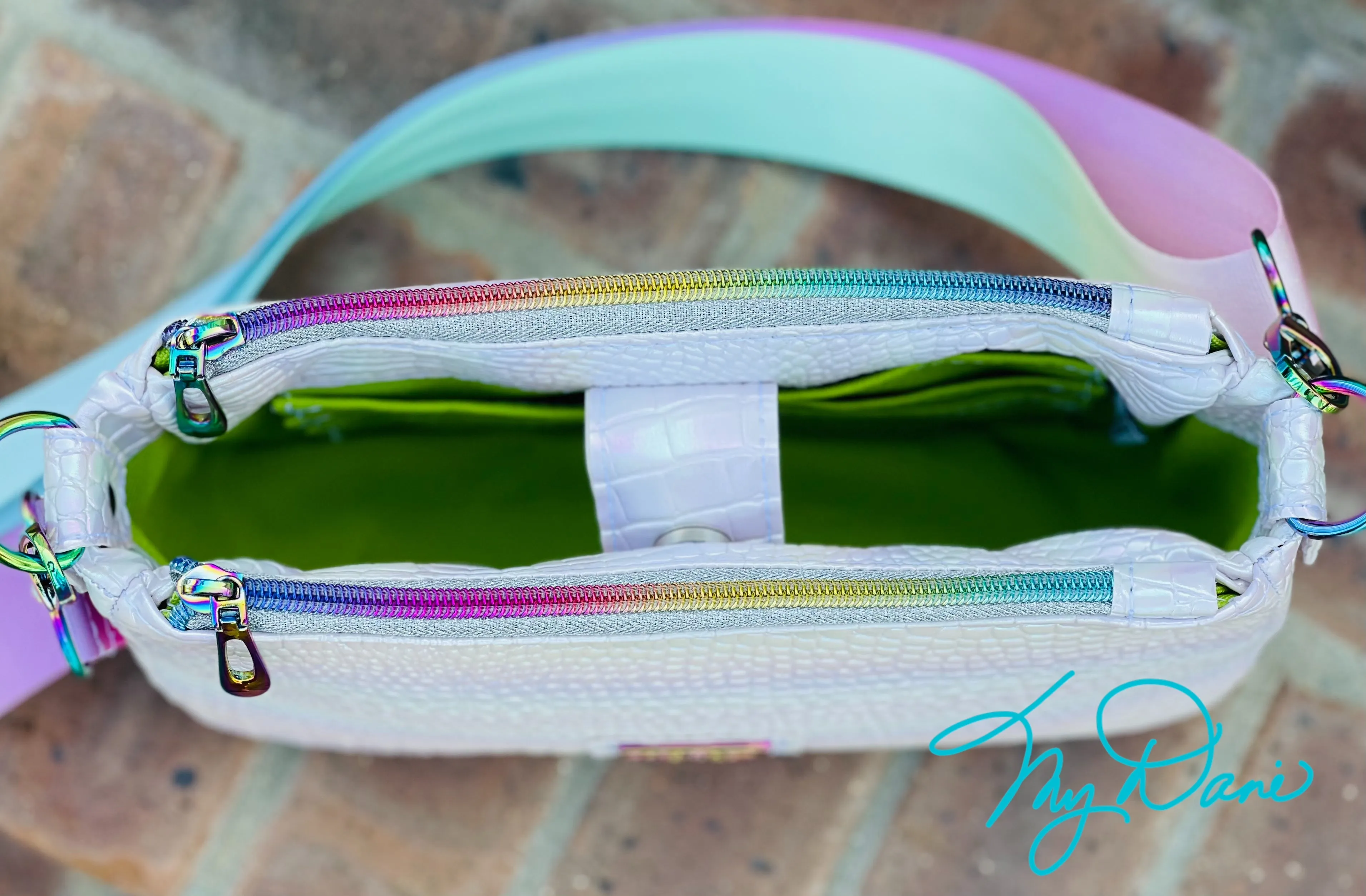 The Aries Crossbody Handbag in Iridescent White.